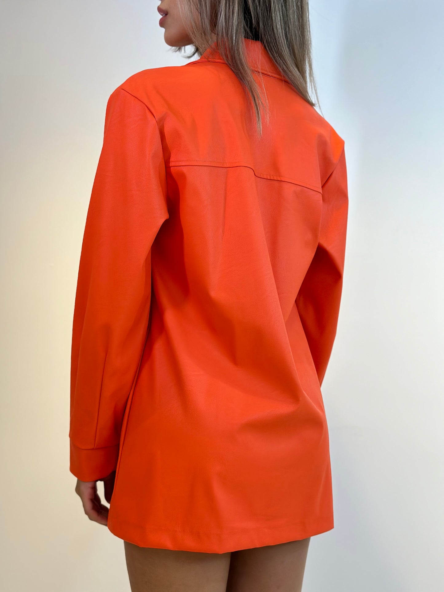 Long solid dress by Charry, featuring a sleek design and elegant silhouette in a neutral color.