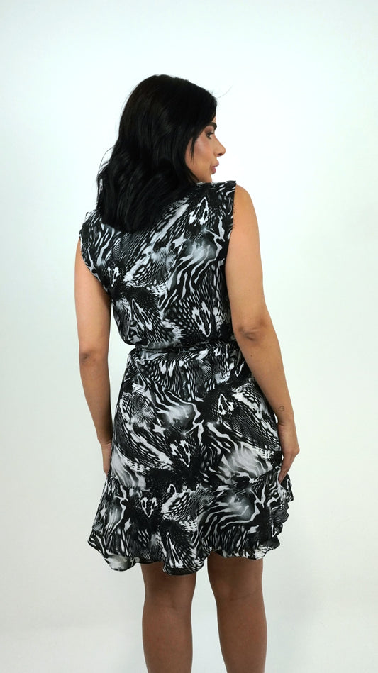 Floral Delphine dress by Wanessa Lopez Concept, featuring vibrant colors and a flowing silhouette.