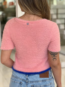 Blusa cardigan de tricot manga curta em tom suave, da marca Wanessa Lopez Concept, com detalhes de textura visíveis.