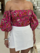 Cropped floral top by DELPHYNE featuring a vibrant print and stylish design, perfect for casual outfits.