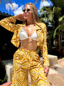 Calça longa com estampa de abacaxi da marca FARM, destacando o design vibrante e leveza do tecido.