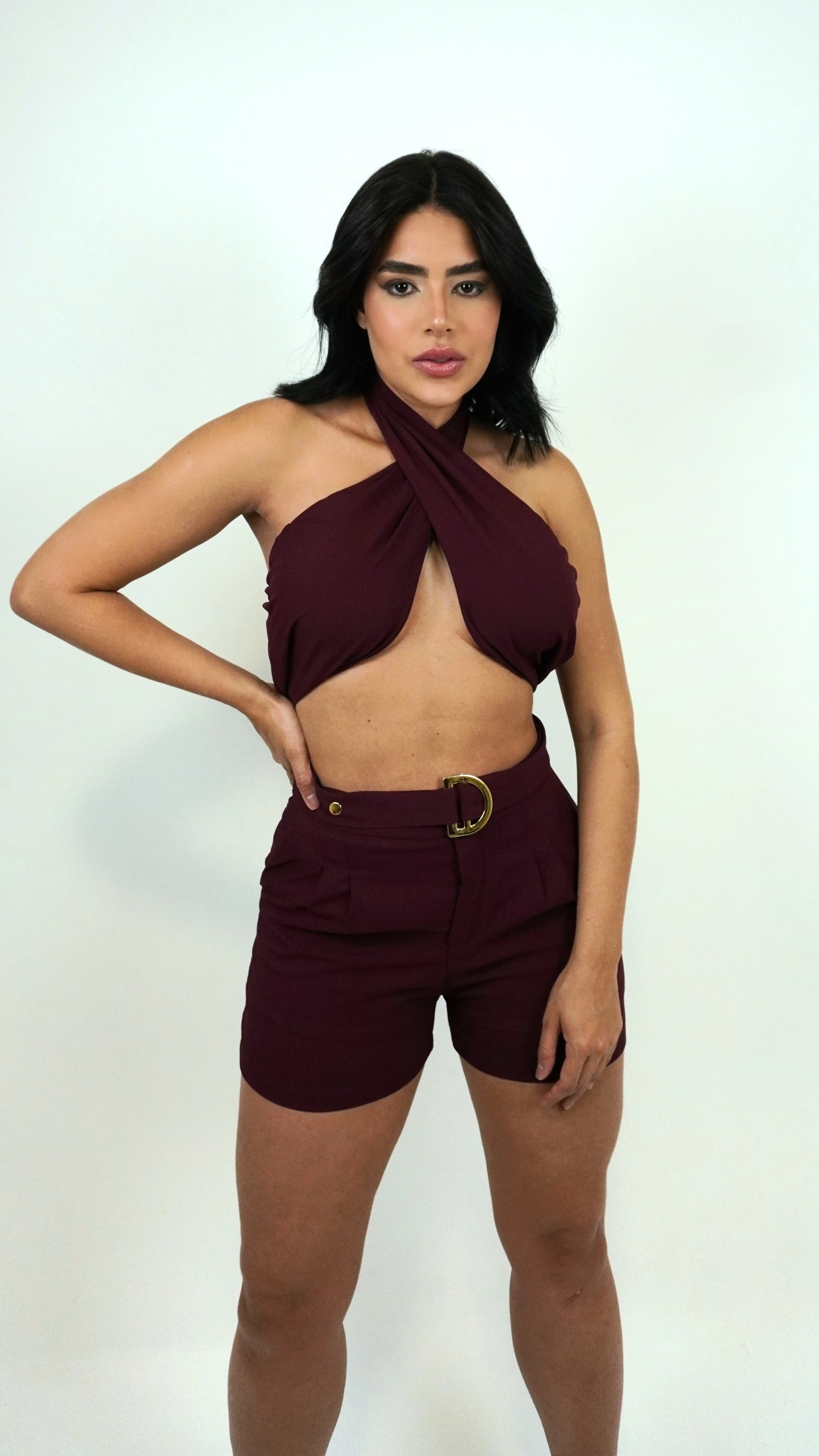 Cherry red short with belt from Wanessa Lopez Concept, featuring a stylish design and tailored fit.