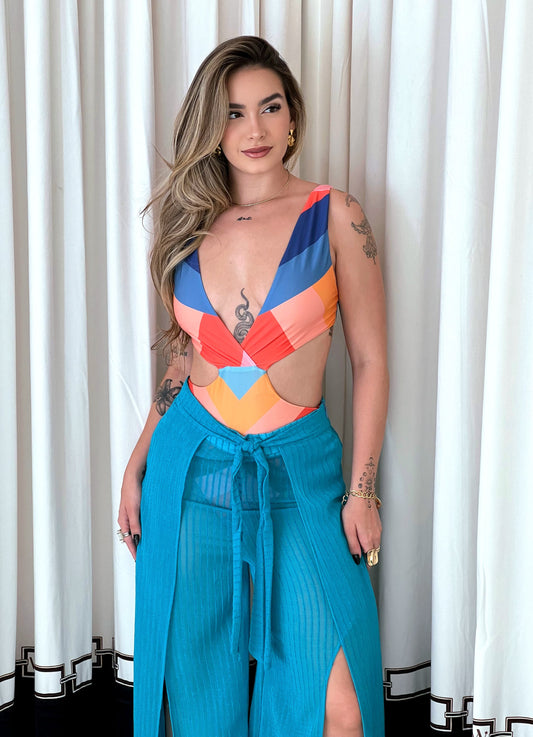Colorful MAIO LOCALIZADO LISTRA AMANDA ESTAMPADO swimsuit by Wanessa Lopez Concept displayed on a light background.