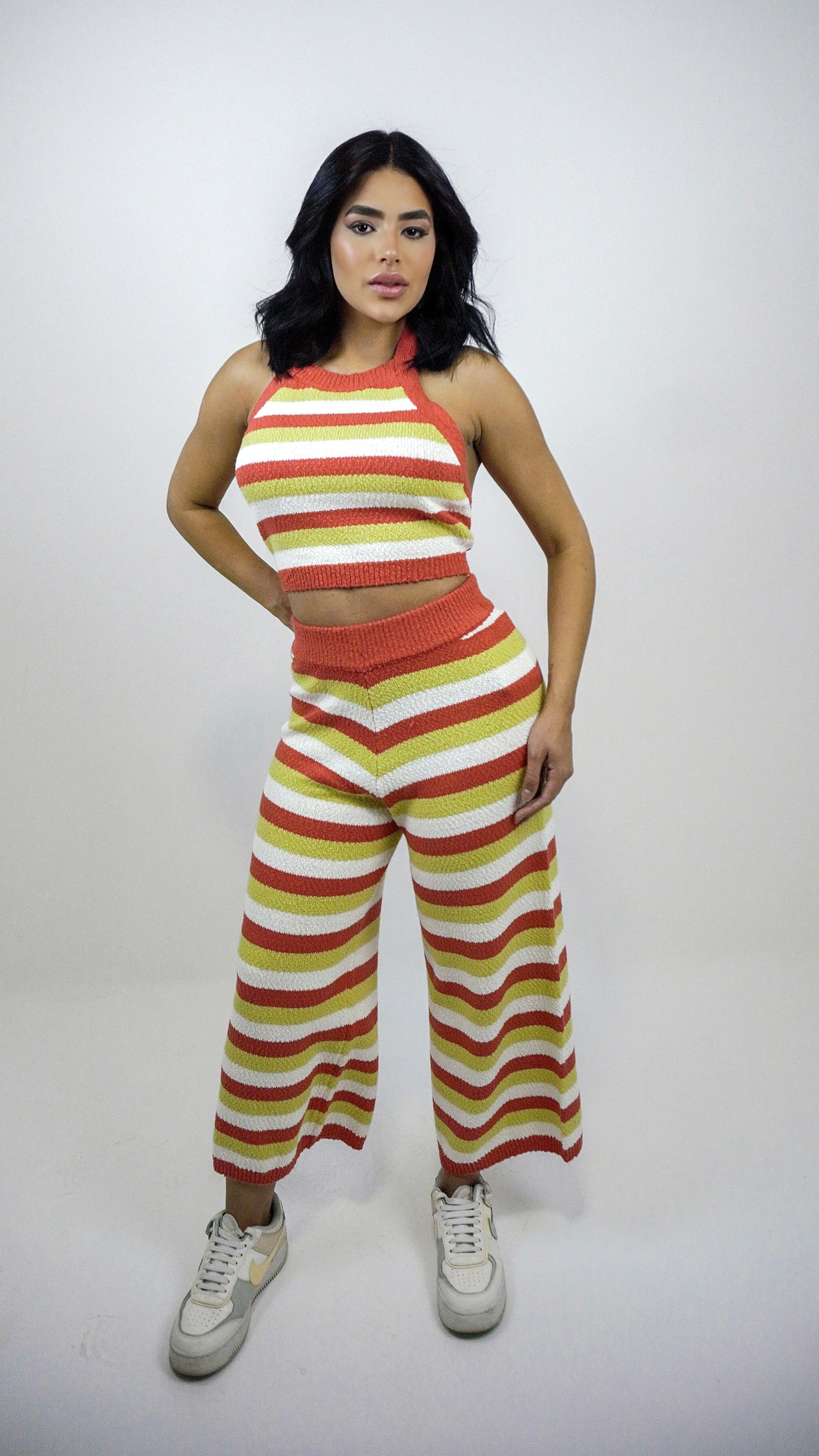 Wanessa Lopez Concept unique front knit top in animal print, showcasing vibrant colors and a stylish design.